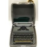 Vintage Olympia typewriter in original metal case