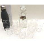 A boxed Bentley motorsport water bottle together with a set of boxed whiskey tumblers and whiskey