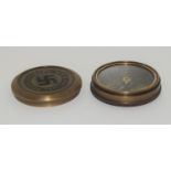A Brass compass with German inscription.