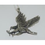 A silver marcasite set american eagle pendant necklace with ruby eyes.