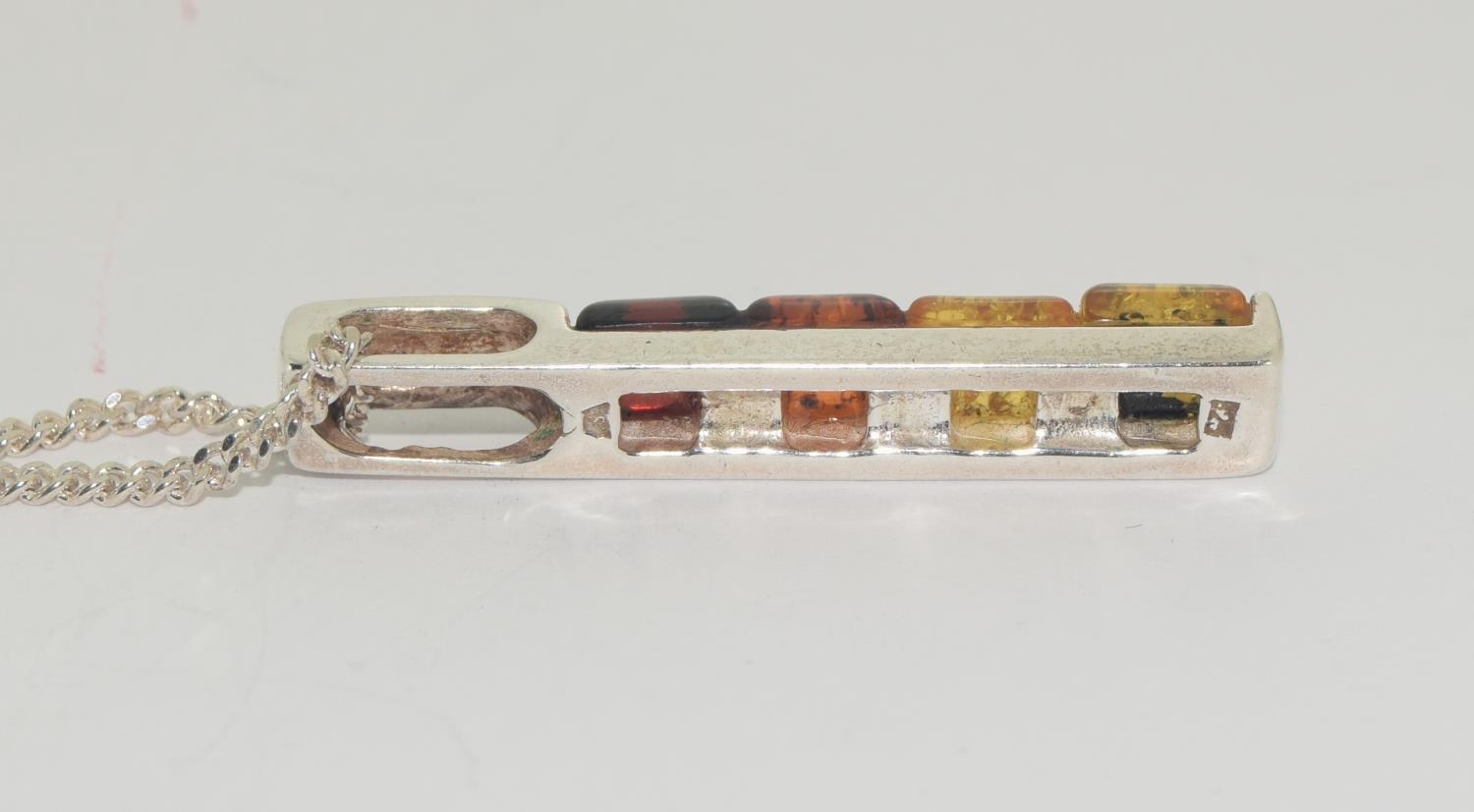 Multi coloured baltic amber 925 silver line pendant. - Image 3 of 3