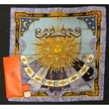 A genuine Hermes Carpe Dien scarf in original packaging complete with Hermes gold plated scarf ring.