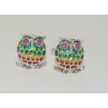 A pair of silver plique a jour owl cufflinks.