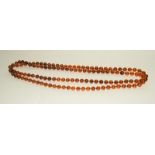 A 46" amber colour necklace.