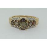 A 10ct yellow gold tourmaline and diamond ring,