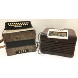 Vintage Bush Bakelite valve radio together with a vintage Traviata accordion.