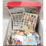 Box with a large quantity of used stamps to sort