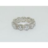 A sparkling 11 stone 925 silver ring, Size N 1/2.