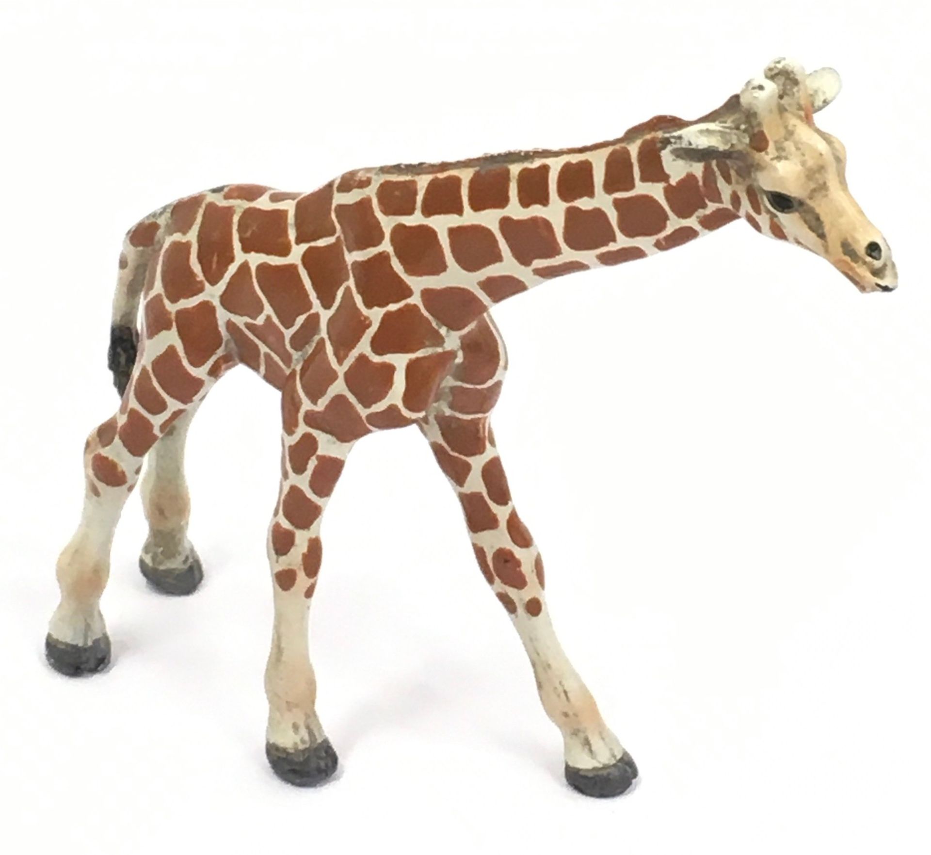 Cold painted figure of a Giraffe stamped to leg