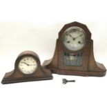 Pair of oak mantle clocks: A small Napoleons hat clock with a Swiss 8 day movement and a larger