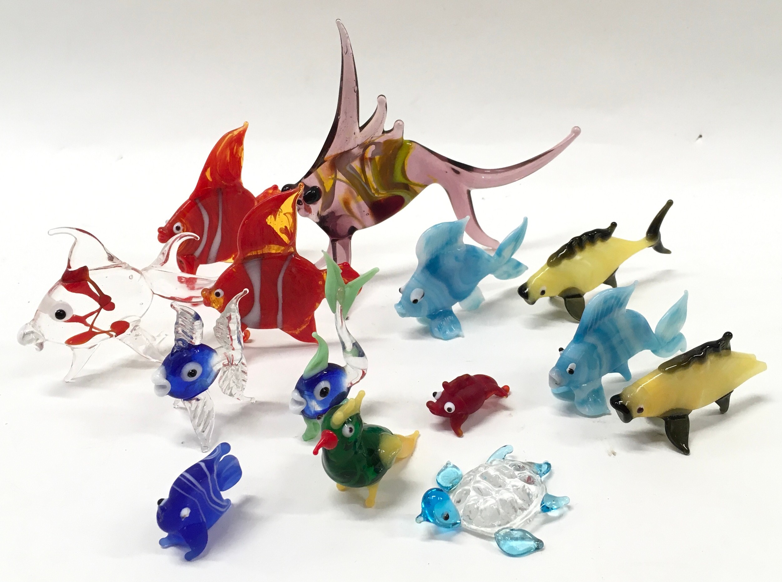 A collection of small Murano glass fish.