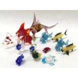 A collection of small Murano glass fish.