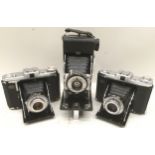 Collection of vintage 120mm film bellows folding cameras consisting of a Kershaw eight-20, a Zeiss