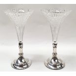 A pair of silver plate and glass fluted epergnes.