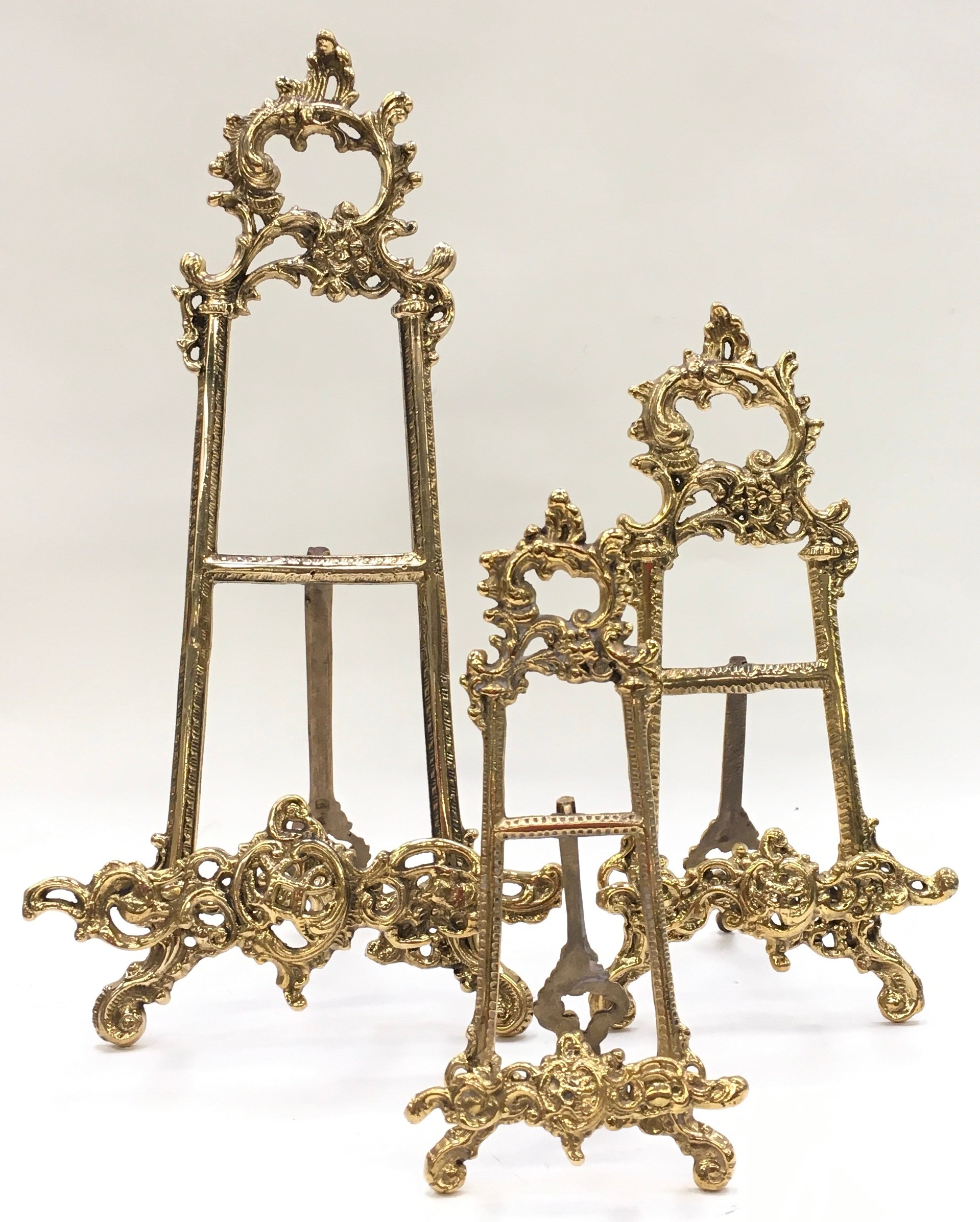 A set of three brass graduated easel back picture frame holders. - Image 3 of 3