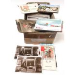 A box of assorted topographical postcards.