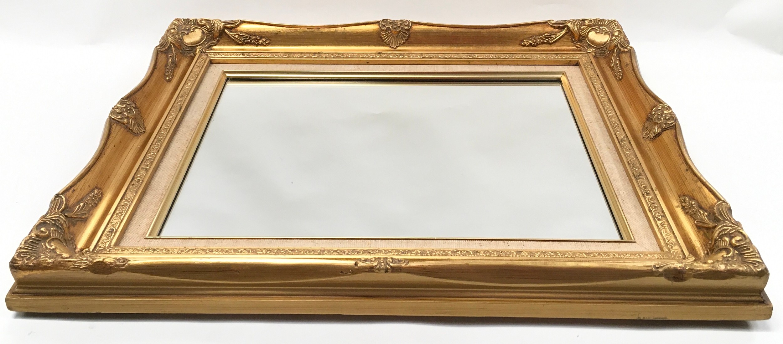 Fancy gilt frame mirror with shell decoration and fabric inner 55x45cm