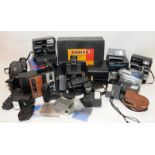 Collection of vintage camera accessories to include lenses, flash units and filters. Also includes a