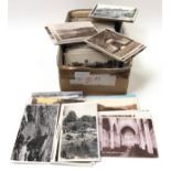 A box of assorted topographical postcards.