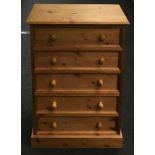 Contemporary pine 5 draw chest of draws set on squared plinth base 90x65x40cm