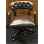 Button back captains office chair set on 5 splayed legs with castors with adjustable height levels