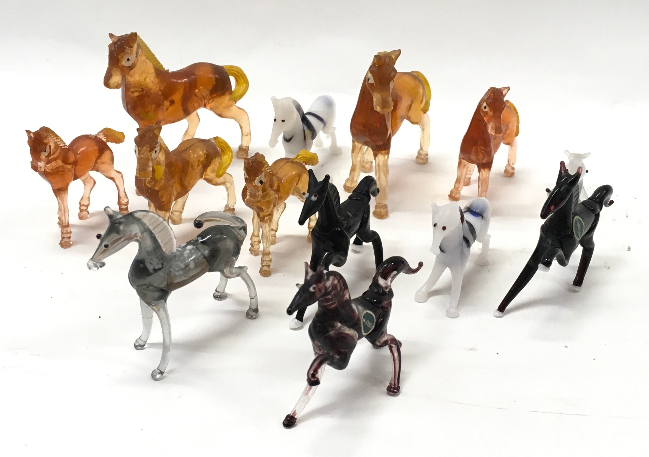 A selection of Murano glass and other miniature horses