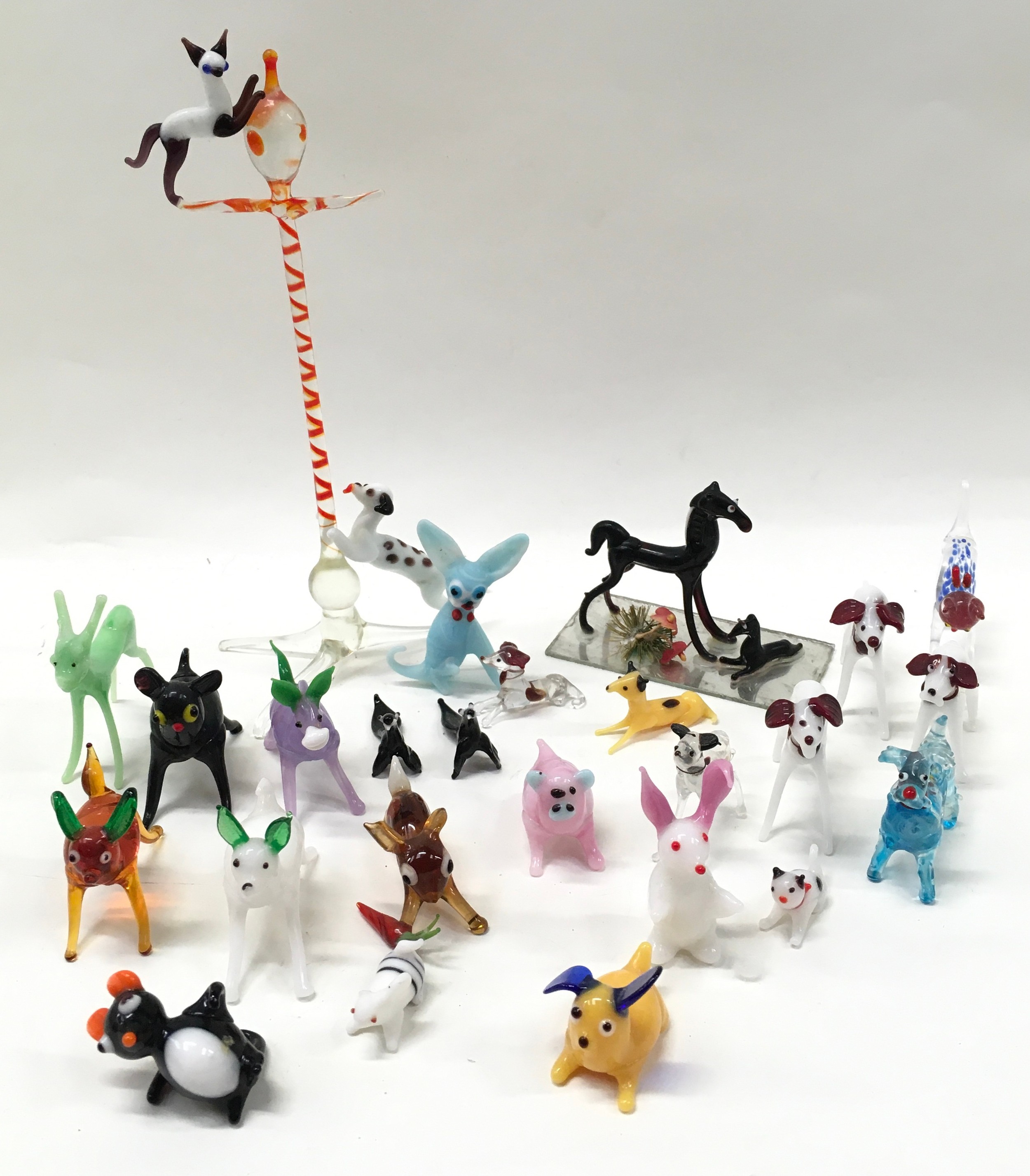 A collection of small Murano glass animals.
