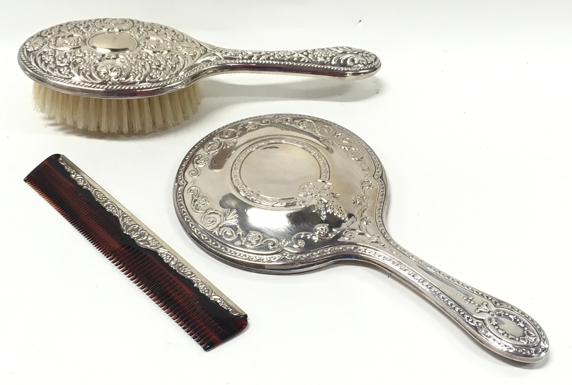 Silver H/M dressing table set by "Carrs"