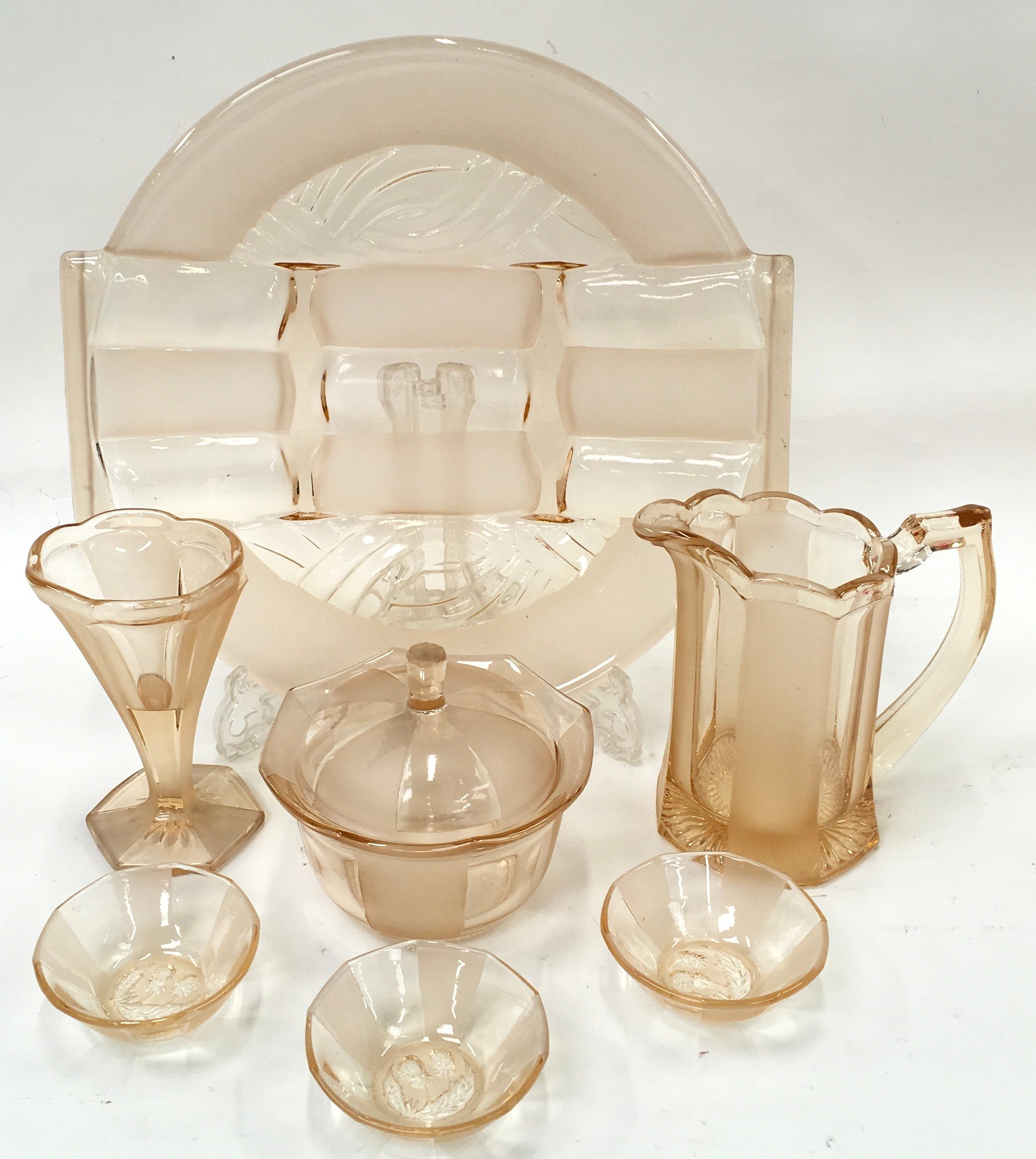 A collection of vintage Art Deco amber coloured dressing table glassware.