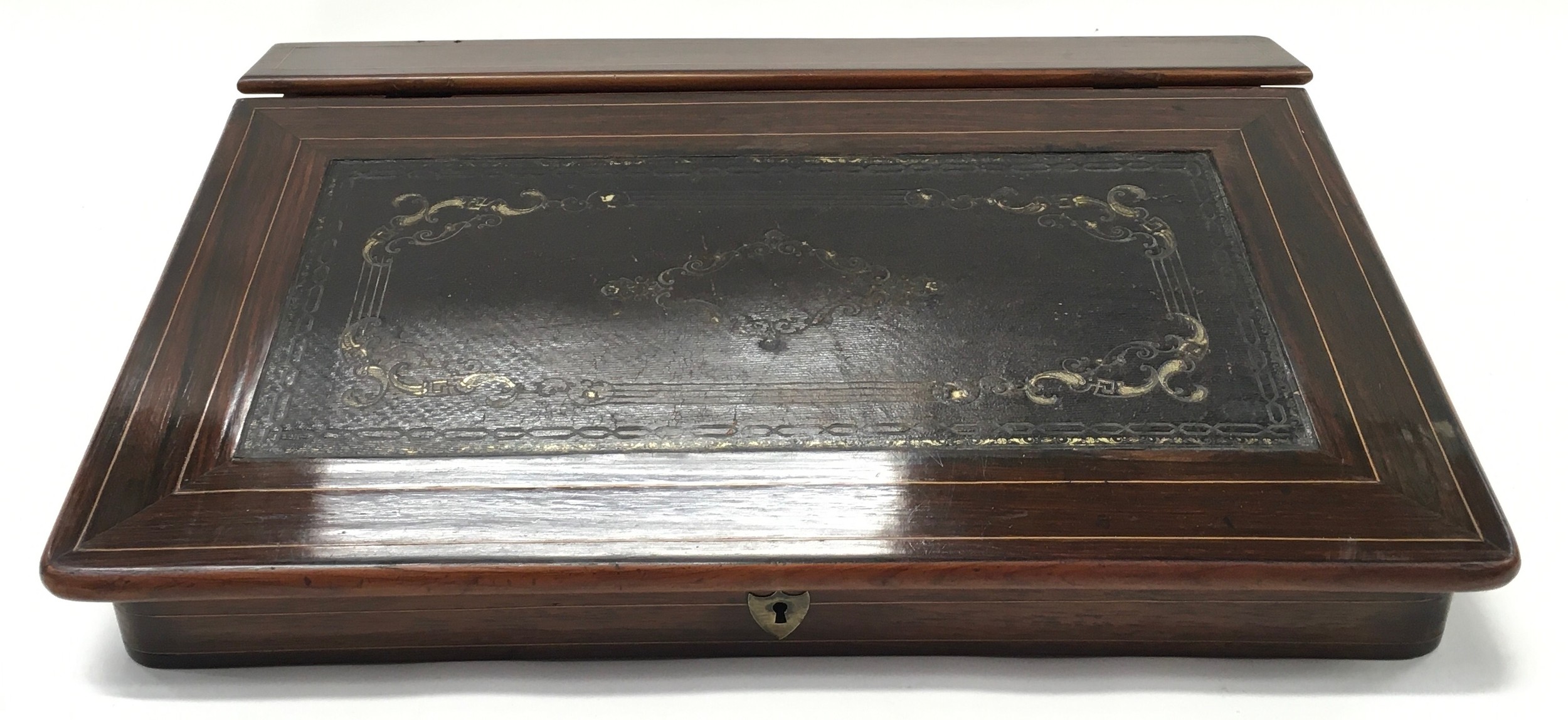 A Rosewood tabletop writing slope with two hinged compartments, leather insert, circa 18th century.