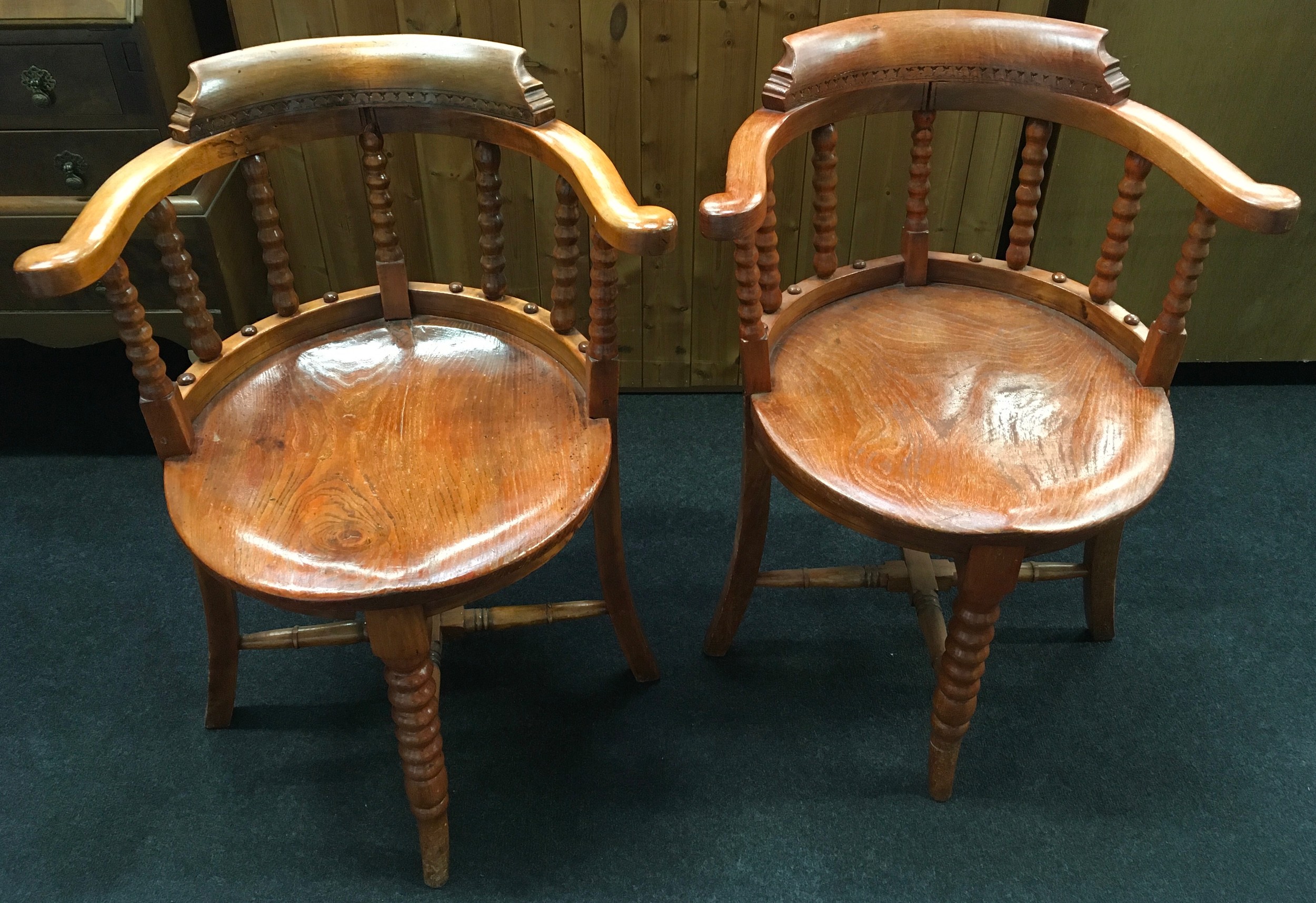 Pair hard wood round back carver chairs with central turned front leg and turned back supports