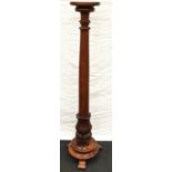 Mahogany Tall torchiere with scalloped base decoration and tapering length stood on three legged
