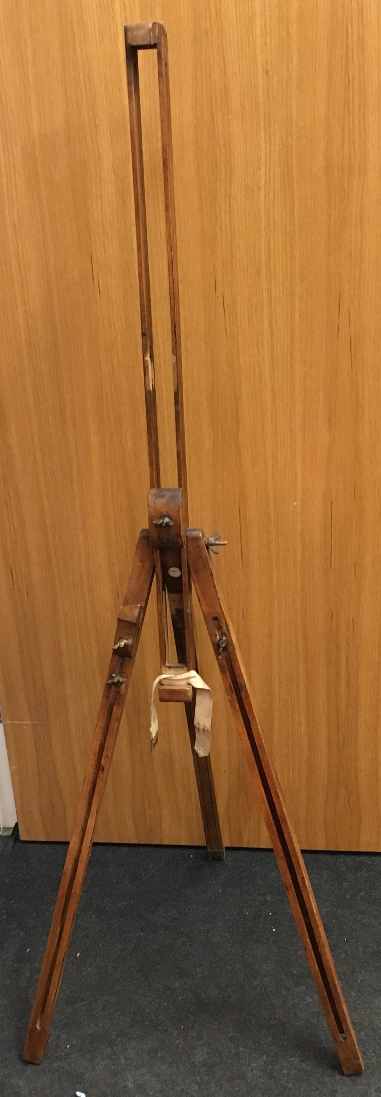 A vintage wooden easel 136cm tall.