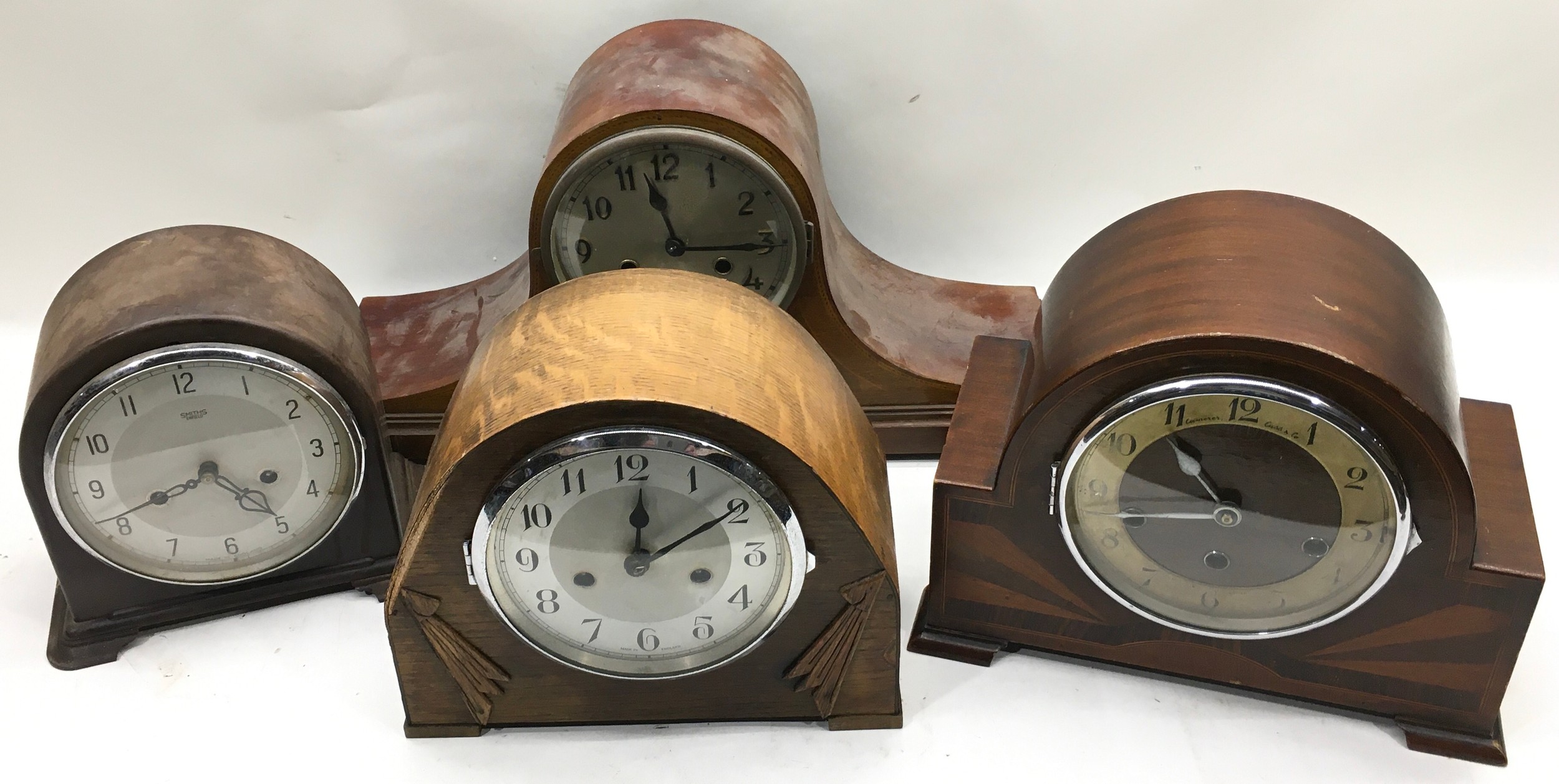 4 vintage mantle clocks to include a Napoleons hat example. Untested