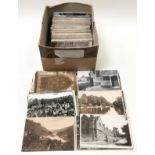 A box of assorted topographical postcards.