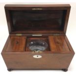 A 19th century Rosewood sarcophagus shaped tea caddy complete with mixing bowl.