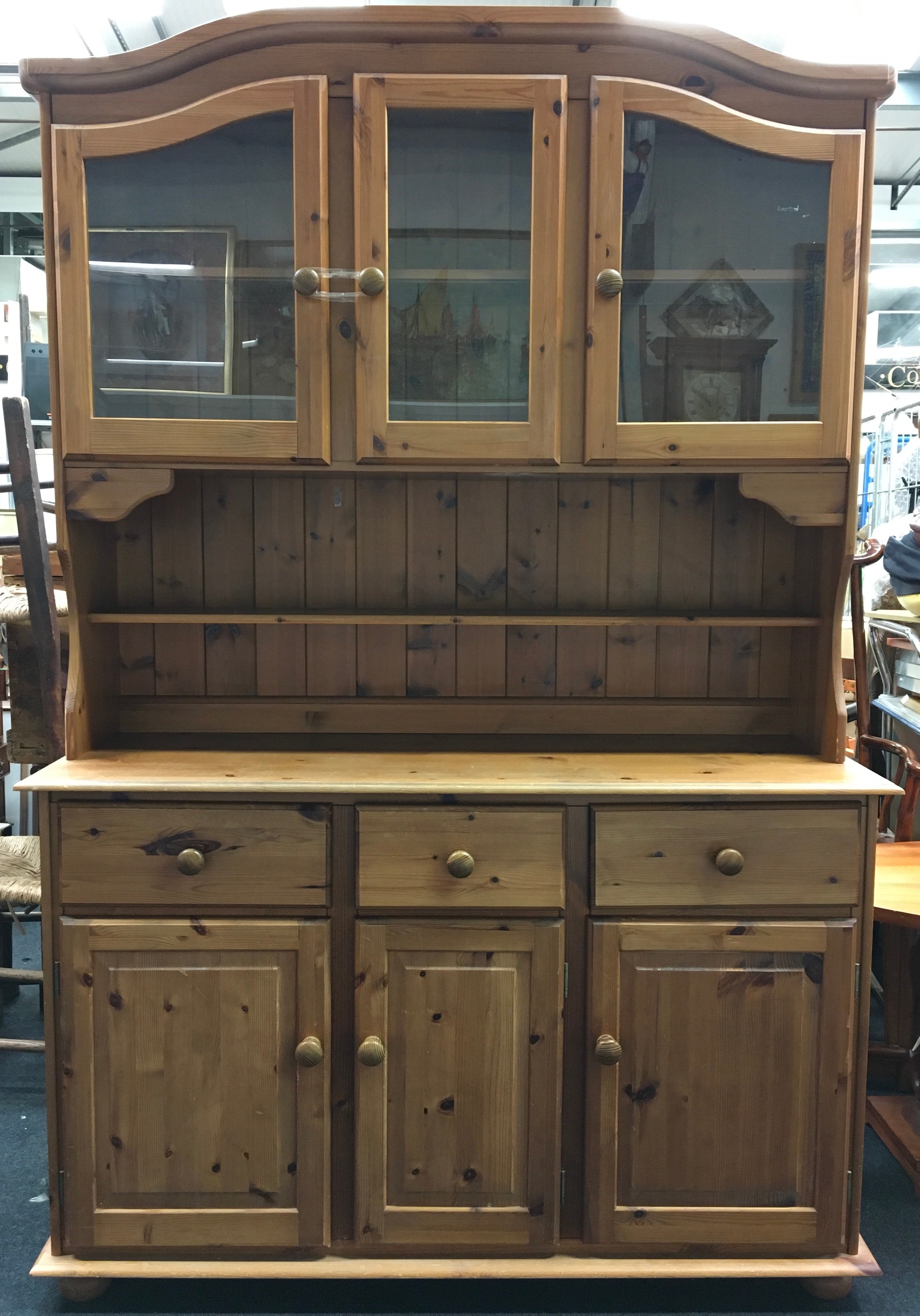 Pine two part dresser having 3 glassed upper cupboards over a 3 draw 3 cupboard base 190x130x40cm