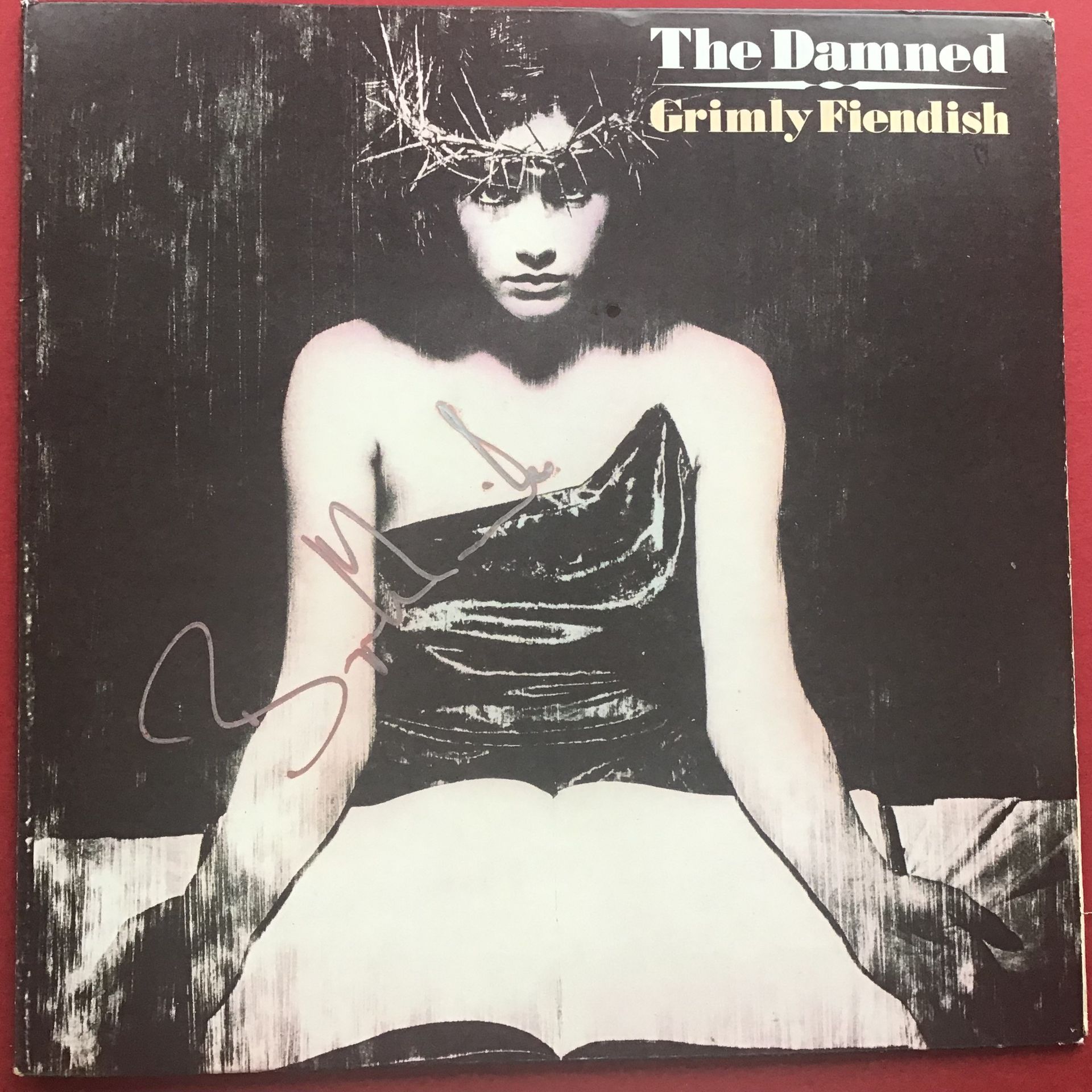 THE DAMNED - 'GRIMLY FIENDISH' 7" G/F P/S SIGNED BY BRYN MERRICK. Released in 1985 on MCA Records