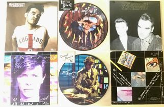 DAVID BOWIE AND MORRISSEY 7” SINGLES. First we have 2 sealed singles - Morrissey “Glamorous Glue”
