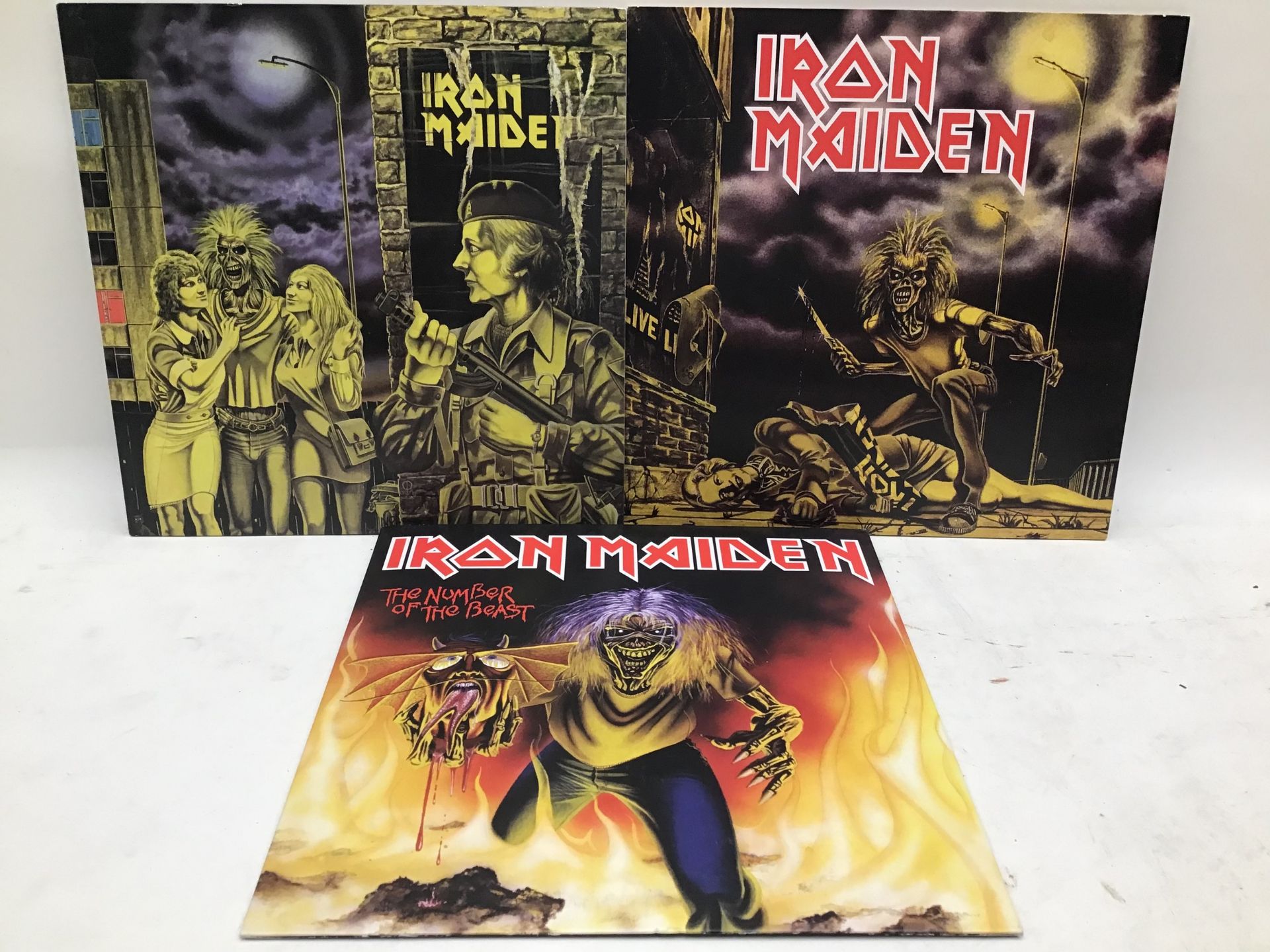 IRON MAIDEN SINGLES X 3. Titles here include - The Number Of the Beast - Women In Uniform and