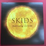 SKIDS 'BURNING CITIES' RED VINYL LP. The Scottish post-punk pioneers triumphantly return with a