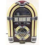 WURLITZER STYLE JUKEBOX. Here we have a table top jukebox which lights up and plays radio and