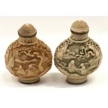Pair of heavily carved oriental perfume bottles each 7x5cm.