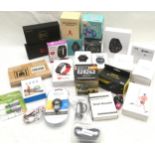 box of mostly new smartphones, fitness trackers, earphones etc