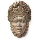 A wall pocket depicting an African female with a head dress 44x33cm.