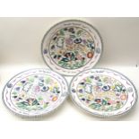 Set of three Poole Pottery 10.5" footed plates in the popular SK Persian Deer pattern. Each has