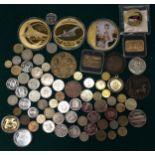 A box of Concorde medallions and other coins and medallions.