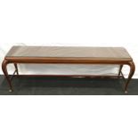 Mahogany long coffee table on cabriole legs and cross stretcher and a glass covering 45x135x35cm