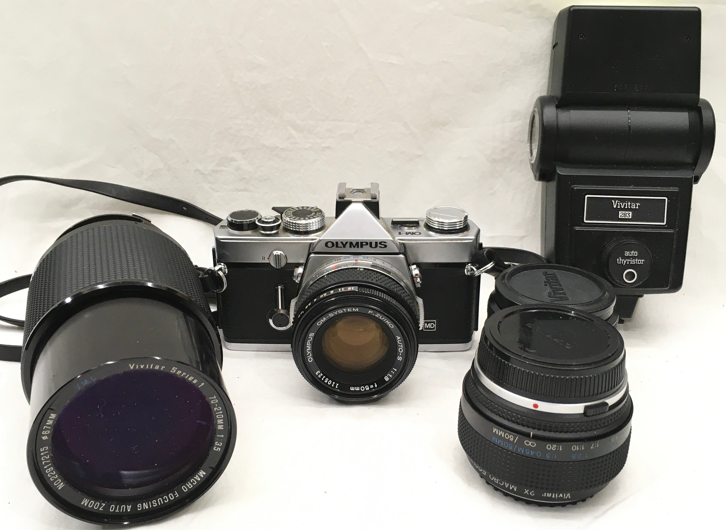 Quality vintage Olympus OM1 35mm SLR camera c/w Olympus 1:1.8 50mm prime lens, Vivitar 1:2.8 28mm