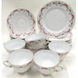 Bavarian porcelain tea service with pink rose pattern. Teacup, saucer and side plate for 6 settings.